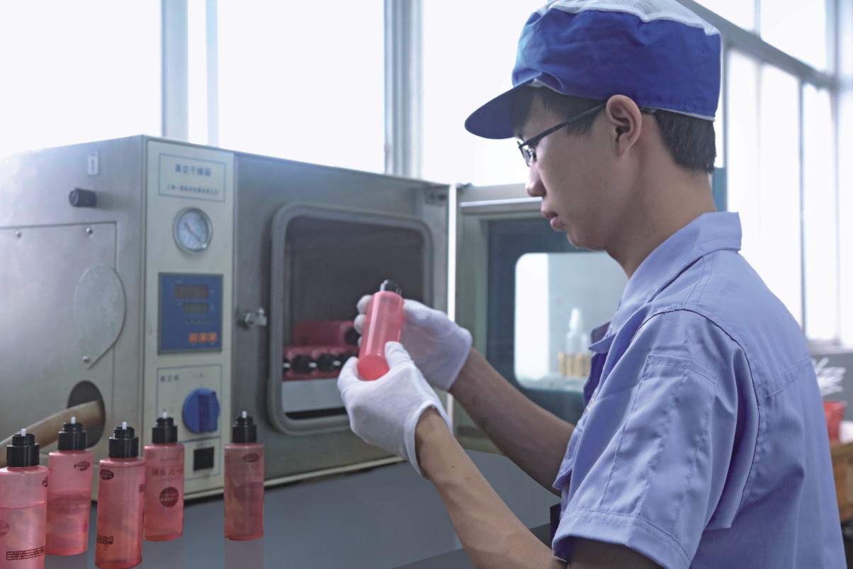 Inspector checking cosmetic packaging components